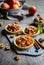 Fruit tartlets filled with caramelized apple pieces, cinnamon and walnuts