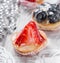 Fruit tarts with berries and strawberry on light background close up. Delicious dessert and candy bar.