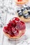 Fruit tarts with berries and strawberry on light background close up. Delicious dessert and candy bar.