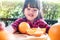 Fruit and Vegetable for Kids Concept. Little Cute 3-4 Years Old Girl with Sliced Orange on Wooden Plate. Fresh Juicy Fruit in