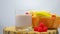 Fruit yogurt in a glass on a wooden board and with fruits in a basket