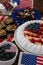 Fruitcake served in plate on wooden table