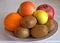 Fruits on  background Kiwi Apple pomegranate Orange