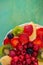 Fruits and berries in sweet gelatin on the cake. Background of strawberries, kiwi, currants, raspberry, pineapple, blackberry.
