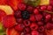 Fruits and berries in sweet gelatin on the cake. Background of strawberries, kiwi, currants, raspberry, pineapple, blackberry.