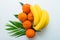 Fruits. A bunch of bananas and tangerines on a white background. Flat lay.