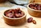 Fruits dates in wooden bowl on table