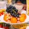 Fruits-grapes, oranges, tangerines, lemon on holiday table