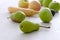 Fruits on a gray, wooden table.