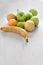 Fruits on a gray, wooden table.