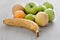 Fruits on a gray, wooden table.