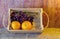 Fruits ( orange , grape ) in an wood box, on sack sisal background