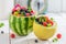 Fruits salad in watermelon and melon with berry fruits