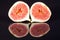 Fruits of sectioned fresh figs on black background
