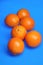 Fruits,several oranges with a blue background