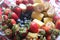 fruits on the table for kids, bananas, strawberies and blueberies