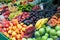 Fruits and vegetables on the counter of the street market. Bananas peaches nuts watermelon melon tomato apples grape plums