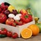 Fruits and vegetables like oranges, apples and tomatoes in box