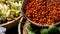 Fruits and vegetables on rustic stall. Assorted fresh ripe fruits and vegetables placed on rustic oriental stall in market. Green