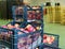 Fruits warehouse with plastic boxes of harvested peaches