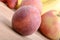 Fruits on wooden table, peach, apple, bananas, food concept