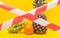 Fruits on a yellow background behind a protective red ribbon, a ban on the importation of fruits and food products, sanctions