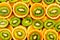 Fruity background set of slices of orange fruit and kiwi. Many slices of kiwi fruit and orange fruit,