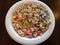 Fruity cereal with marshmellows and milk in bowl