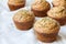 Fruity muffins made with stone ground flour on white kitchen cloth