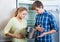 Frustraited starving female and man near fridge without any food