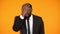 Frustrated afro-american man in business suit making facepalm, shocked with news