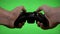 Frustrated angry gamer playing video game match on green screen shaking game remote controller losing game concept -