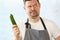 Frustrated Chef Holding Fresh Organic Cucumber