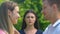 Frustrated lady watching best friend flirting with boyfriend in park, betrayal