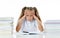 Frustrated little schoolgirl feeling a failure unable to concentrate in reading and writing difficulties learning problem