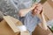 Frustrated man sitting between brown carton boxes