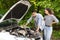 Frustrated middle-eastern couple having broken car while countryside trip