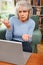 Frustrated Senior Woman Using Laptop