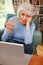 Frustrated Senior Woman Using Laptop