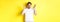 Frustrated and shocked guy panicking, screaming and looking scared, standing in white t-shirt over yellow background