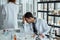 Frustrated upset research scientists feeling tired worried with problem in chemical laboratory