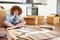 Frustrated Woman Putting Together Self Assembly Furniture