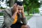 Frustrated young black man sitting on bench outdoors in city, black lives matter concept.