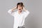 Frustrated young business woman in white shirt posing isolated on grey background. Achievement career wealth business