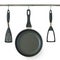 Fry pan and kitchen utensils hanging on a rail