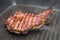 Frying beef steak on a grill pan