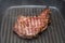 Frying beef steak on a ribbed grill pan