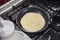 Frying delicious crepe on pan in kitchen