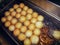 Frying Fish Balls with Oil in a Commercial Deep Fryer.