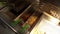 Frying french fries in oil in fast food restaurant kitchen. Overhead view of fast food worker making french fries in a